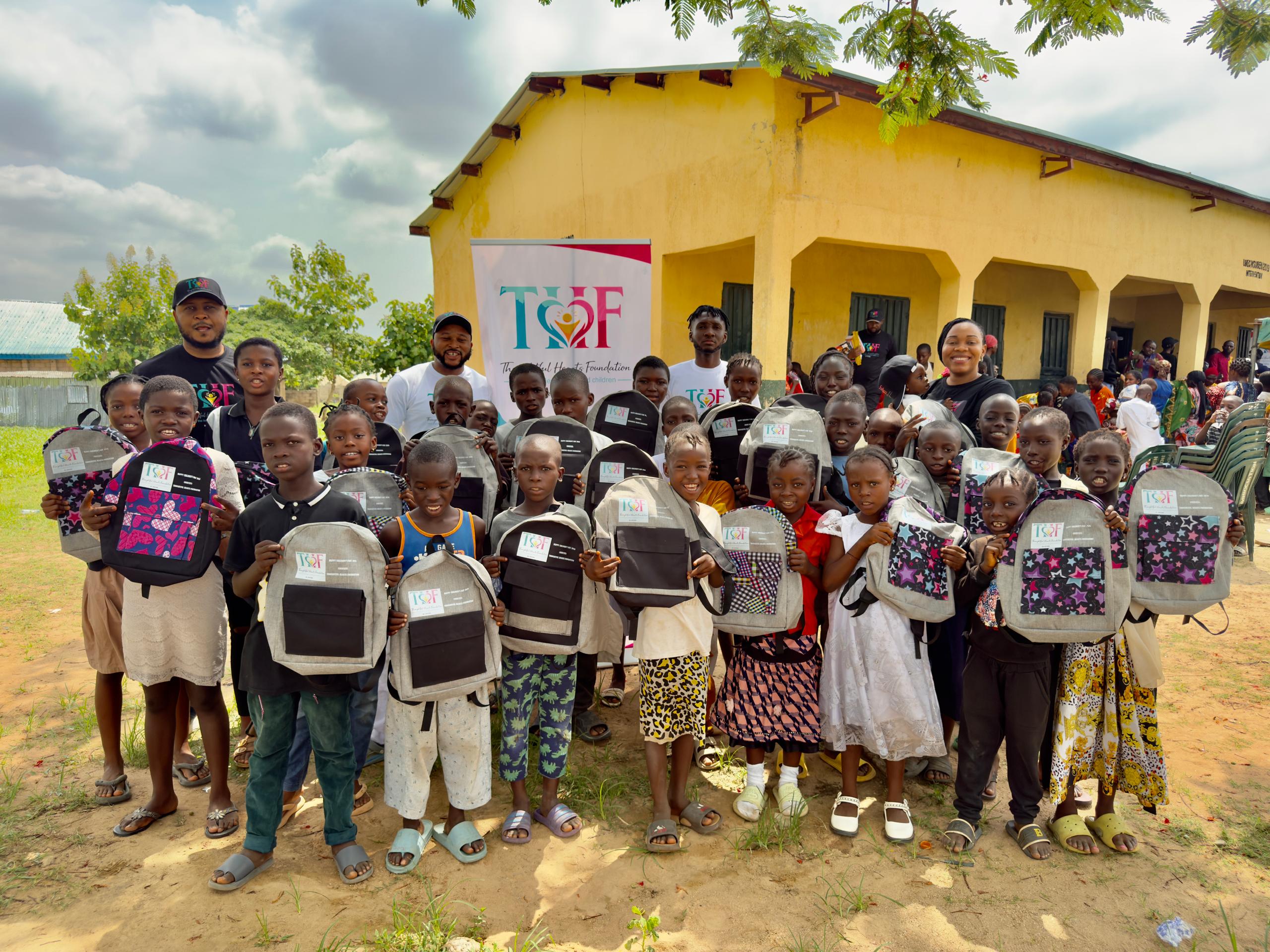 THF team distributing school bags
